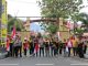 Kolaborasi Polda Sulteng dan FPK, 250 Bendera Merah Putih Dibagikan di Jalan Raya Palu